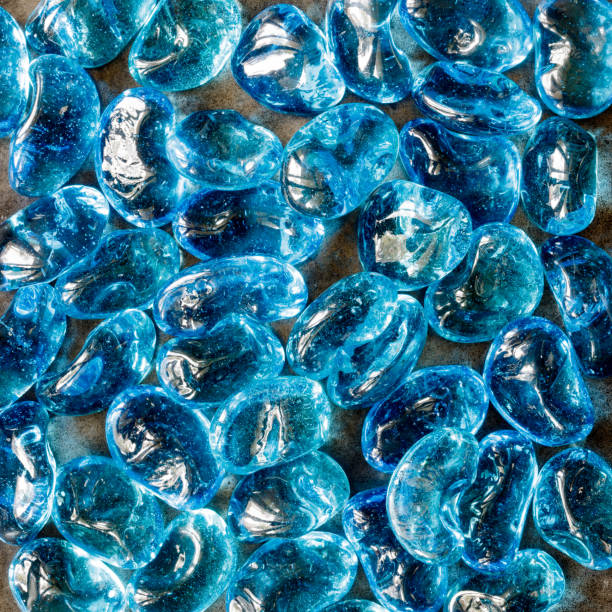 istock Tumbled and Tempered Aqua Blue Jellybean Fire Glass Nuggets 1273225487