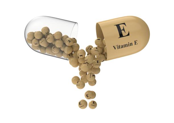 istock Open capsule with vitamin E from which the vitamin composition is pouring 1273227235