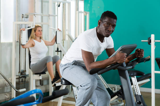 istock Group of people exercising at gym 1273227900