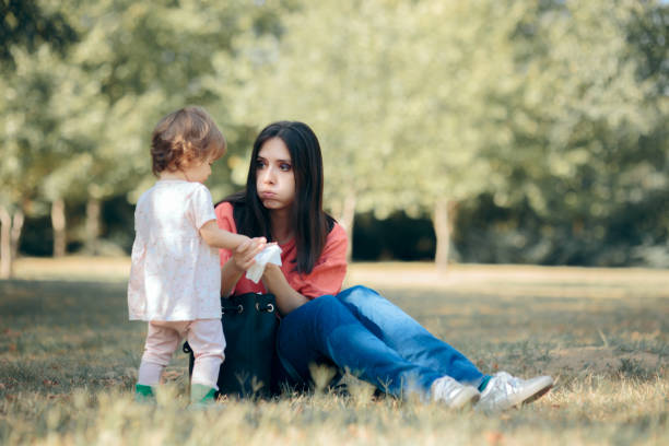 istock Mother Cleaning Her Daughter Hands with Antibacterial Wipes 1273229544