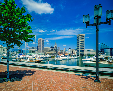 Downtown Baltimore with Inner Harbor view from Federal Hill Park, with recreational yachts.