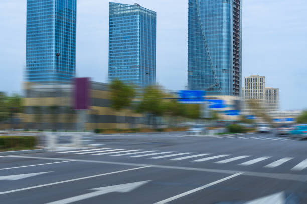 istock empty road with zebra crossing and skyscrapers in modern city 1273233043