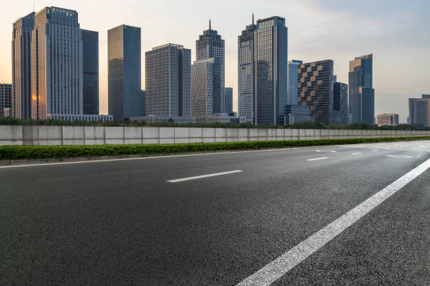 istock empty asphalt road front of modern buildings 1273233098
