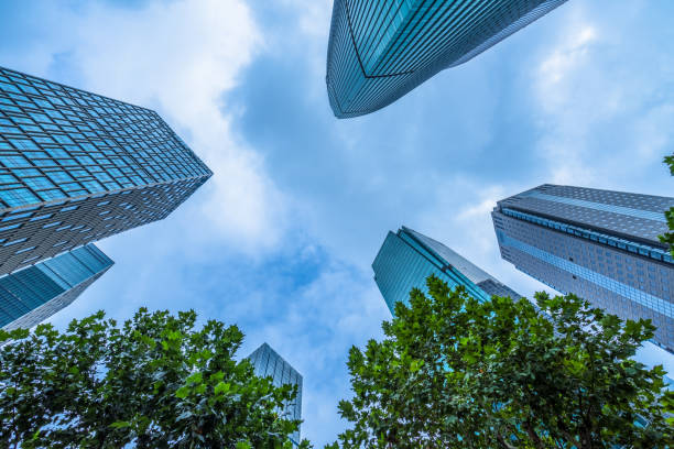 istock Business towers and Green leaves 1273233143