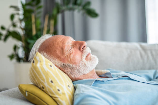 istock Senior man sleeping in the living room 1273233220