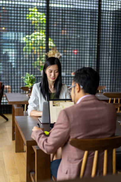istock Asian business executives working at coworking space 1273233300