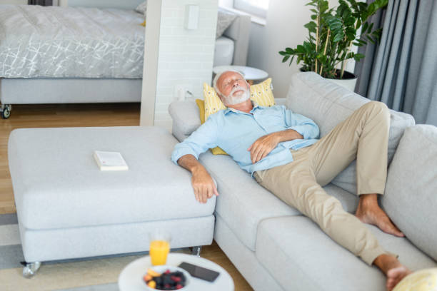 istock Senior man sleeping in the living room 1273233389