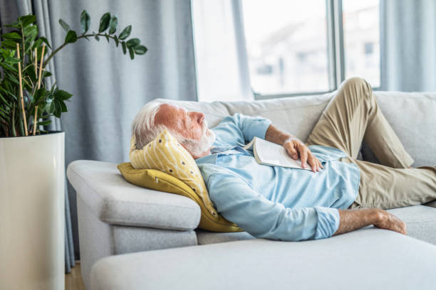 istock Senior man sleeping in the living room 1273234839