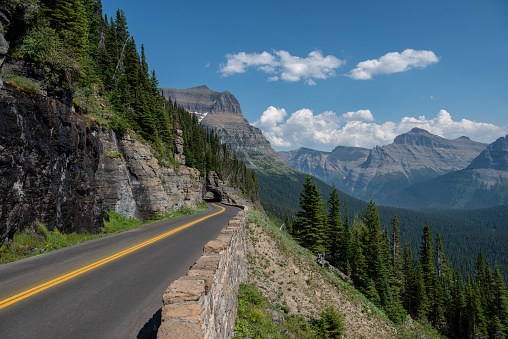 Driving along Going to the Sun Road in Glacier National Park provides surreal scenic beauty.