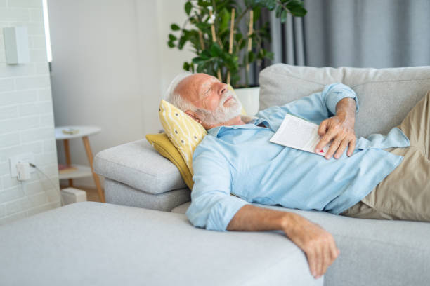 istock Senior man sleeping in the living room 1273235656