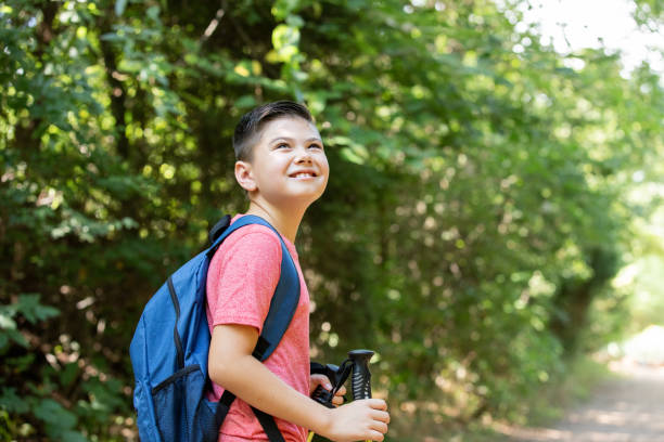 istock Young boy smiles while hiking outdoors 1273239552