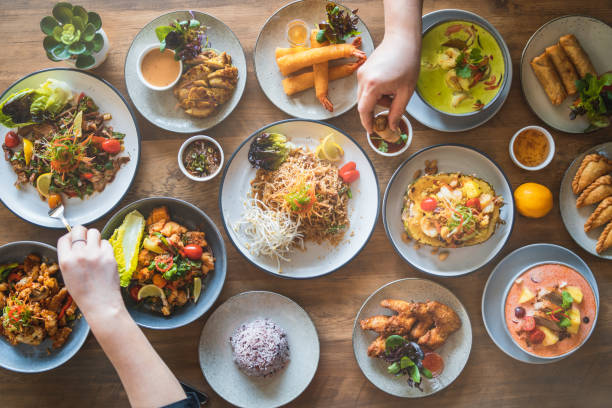 Eating Thai Cusines. Table top view of Thai food displayed on table. thai food stock pictures, royalty-free photos & images