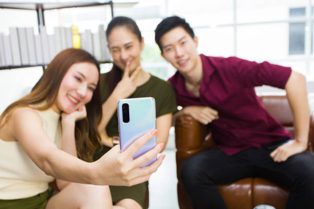 Young people meet, socialize, and take selfies together.