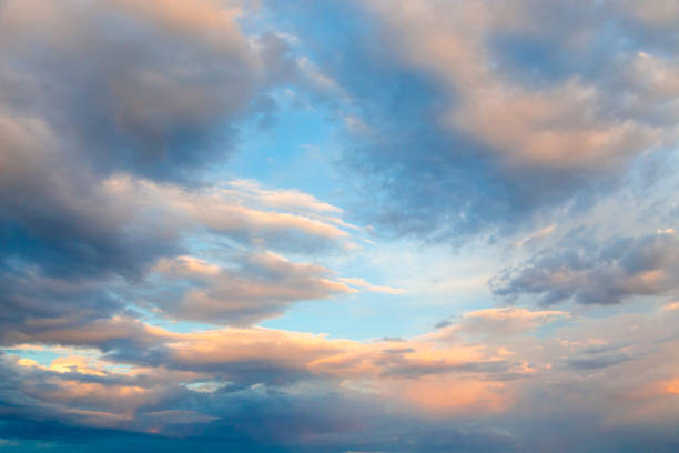 istock Bright cumulus clouds against the blue sky. Sunset sky Natural background. 1273243689