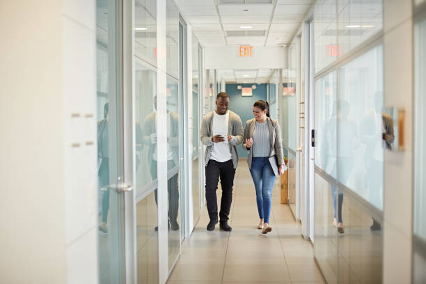 istock Diverse Business Partners Walking in Miami Coworking Office 1273251548