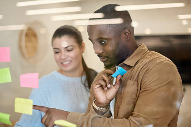 istock Inspired Hispanic and Black Businesspeople Brainstorming 1273251573