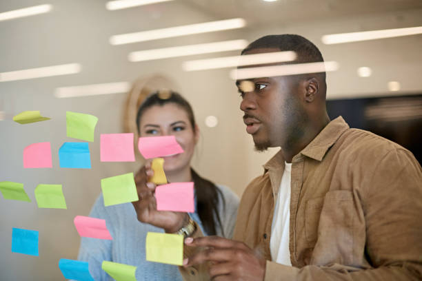 istock Young Black and Hispanic Business Partners Brainstorming 1273251579