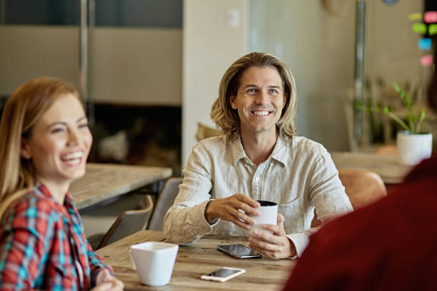 istock Relaxed Business Colleagues Enjoying Coffee and Conversation 1273251580