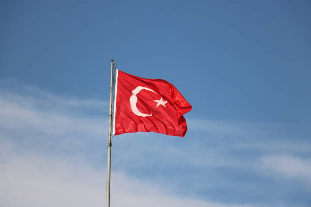 istock flag of Turkey on flagpole against the blue sky 1273251713