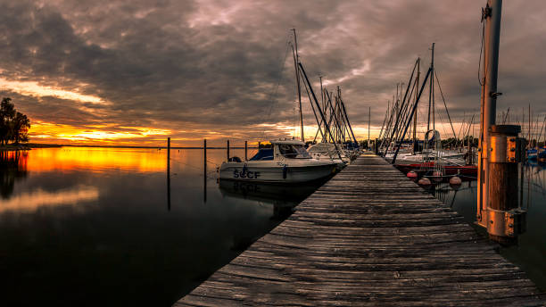 istock Jetty at the Chiemsee in the sunset 1273255789