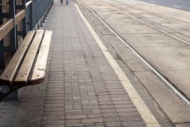 istock Wooden bench at ramway station and rails 1273256811