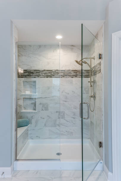 istock Spacious shower with large glass door and chrome handle 1273256899