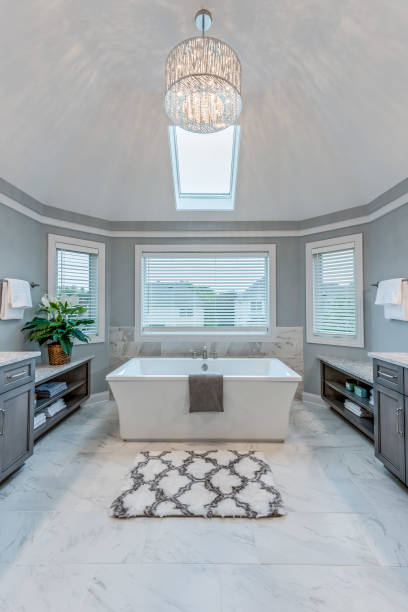 istock Freestanding bathtub sitting perfectly beneath skylight 1273256907