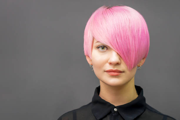 istock Woman with short bright pink hair 1273258533