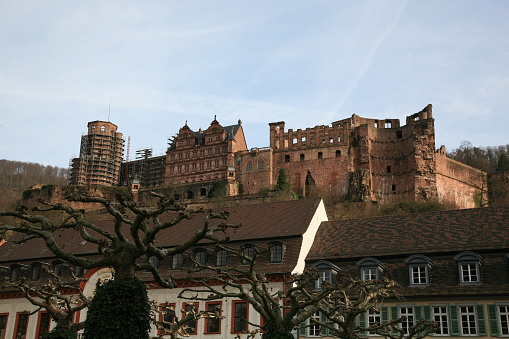View of Heidelberg castle ruins seen from old town Carl's Square  during sunset in  early Spring in Heidelberg, Germany