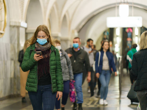 People inside of Moscow subway station Moscow, Russia- September 14, 2020: Moscow subway station exterior in the autumn. A lot of people. Travelling concept. Cotonavirus pandemic. Somebody use/wear / put on protective face masks covid crowd stock pictures, royalty-free photos & images