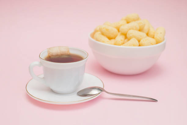 dessert, a cup of tea with a bag, corn sticks