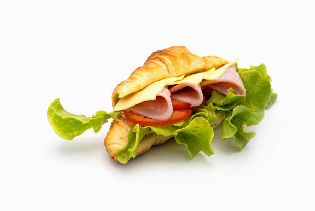 istock mini ham cheese croissant isolated on white background. 1273263254