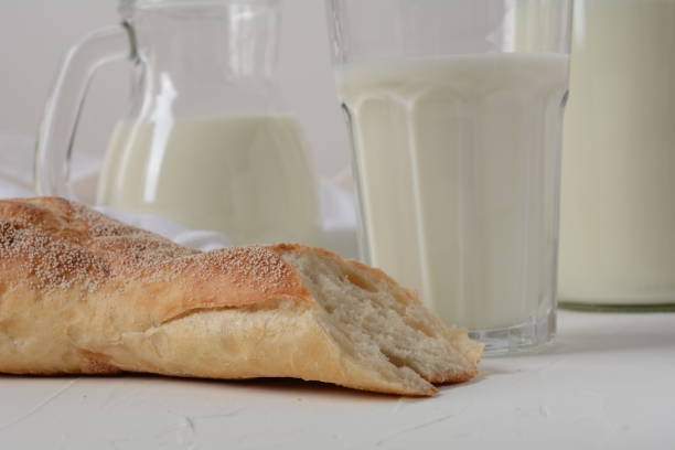 istock Baguette with milk on white background 1273266769