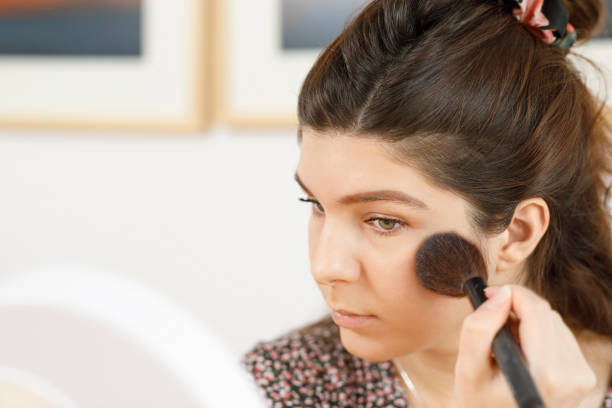 istock Female student Morning makeup, preparation for  e-learning  working at home office, social distancing - quarantine. New normal, illness prevention. 1273266800