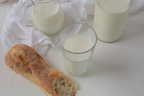 istock Baguette with milk on white background 1273266942