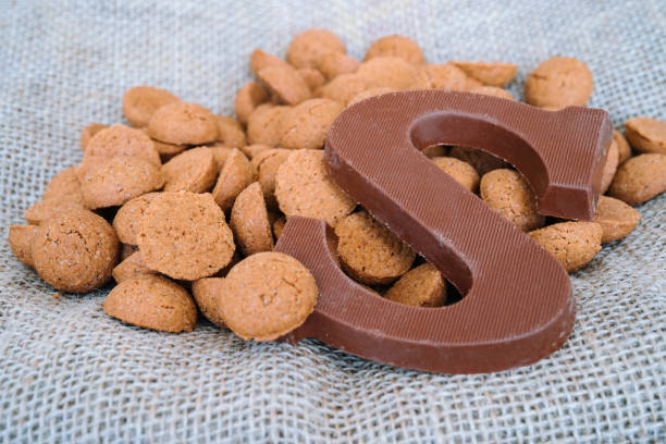 istock Dutch holiday Sinterklaas background with kruidnoten, traditional Sinterklaas sweets.. Pepernoten on sacking for sweets and gift boxes. Concept for children party Saint Nicolas day five december. 1273266989