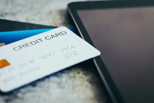 Photo of Credit card with tablet. Online shopping and payment