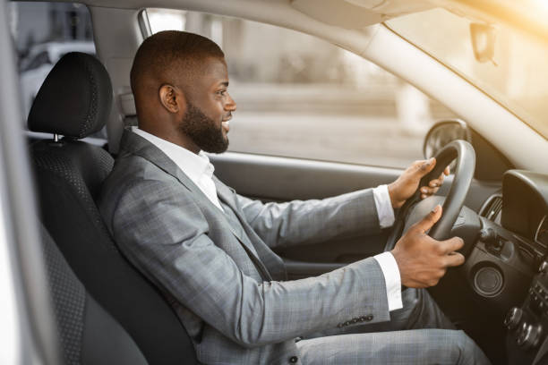 istock Handsome black businessman driving home after working day 1273272475