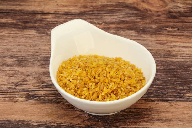 istock Vegetarian cuisine - dry bulgur for cooking 1273272742