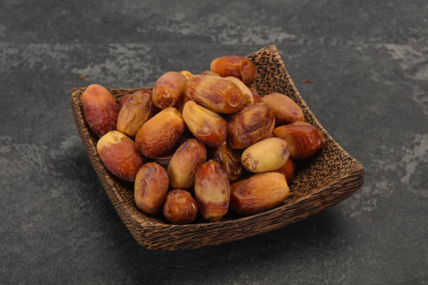 istock Sweet tasty dry dates in the basket 1273272832