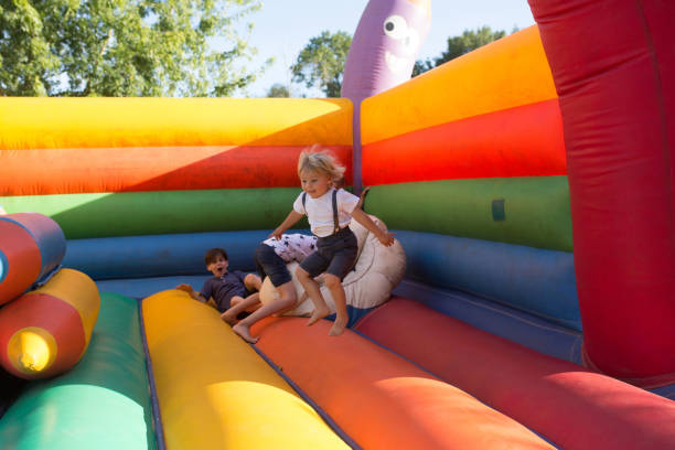 istock Children, boys, playing jumping on colorful trampoline 1273273116