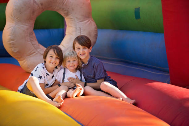 istock Children, boys, playing jumping on colorful trampoline 1273273214