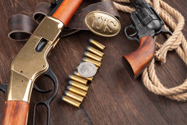 istock Wild west weapons and ammunition with silver dollar 1273275840