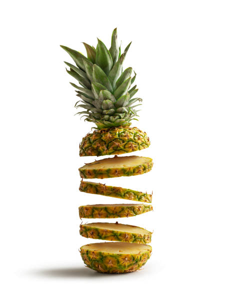istock Fresh pineapple cut into slices flying, isolated from the white background 1273276142