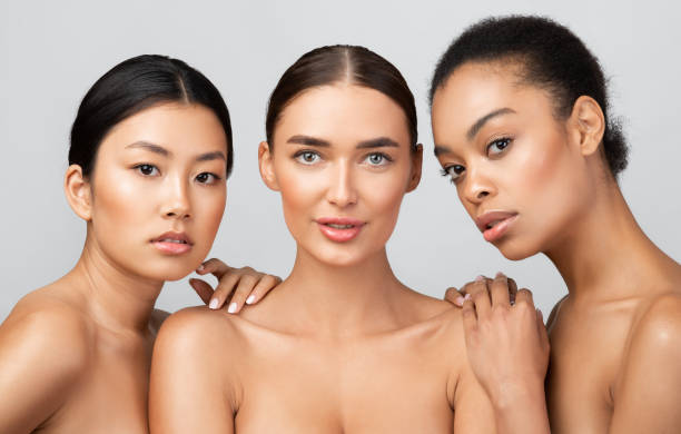 istock Three Young Women Posing Together Shirtless Over Gray Background, Studio 1273277813