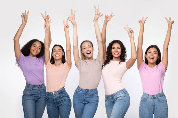 istock Group Of Ladies Gesturing V-Sign Standing Over White Studio Background 1273278649