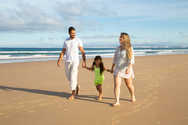 istock Cheerful parents and kid in summer clothes 1273278760