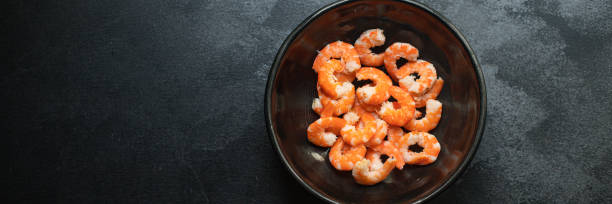 istock shrimp ready to eat boiled or fried seafood prawn without shell on the table serving top view  copy space for text keto or paleo diet pescetarian food background rustic 1273281922