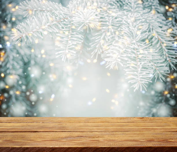 istock Christmas tree branches with wooden background 1273282302