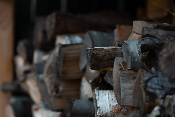 firewood chopped pilled up ready for the fireplace - pilled imagens e fotografias de stock